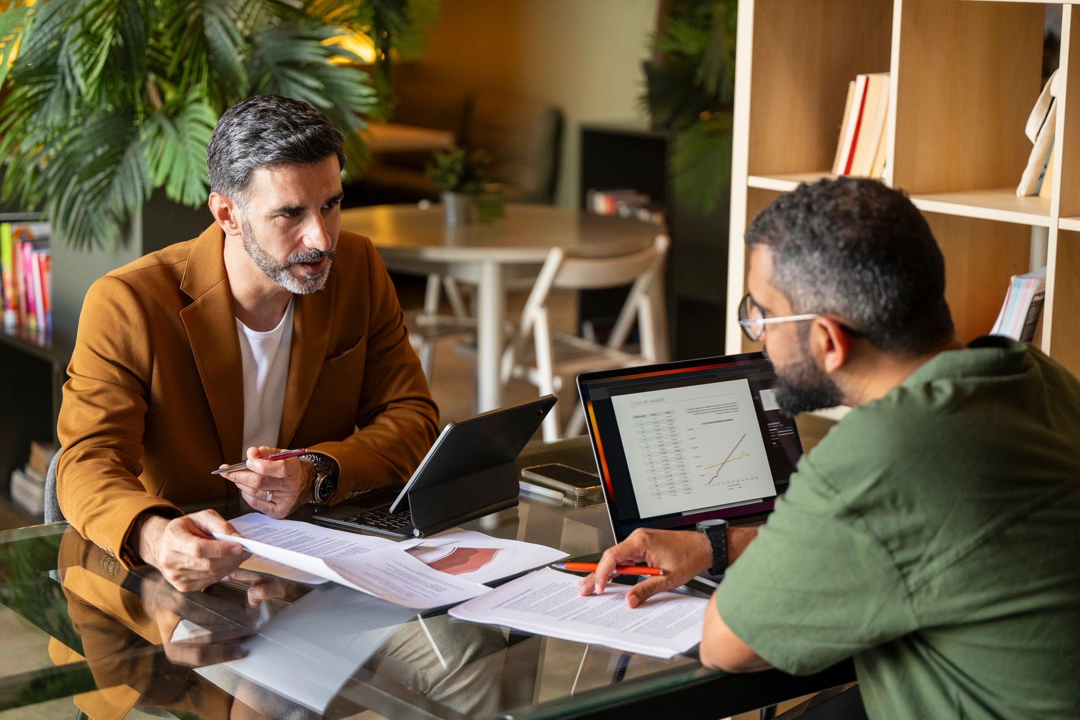 Advisor reviewing documents with clients during a consultation